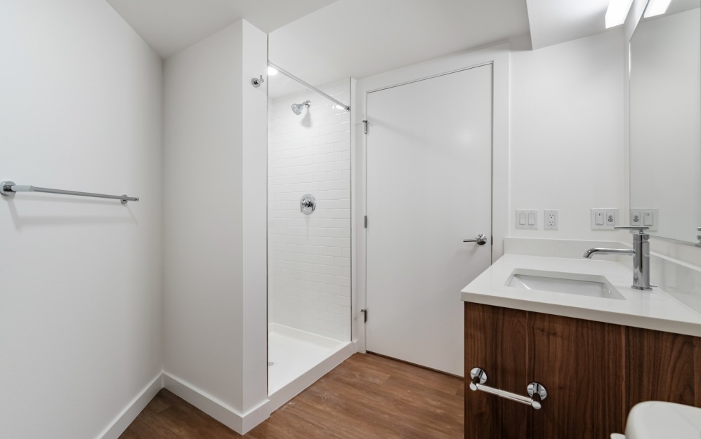 a bathroom with a sink and shower