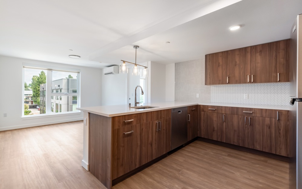 a kitchen with wood cabinets
