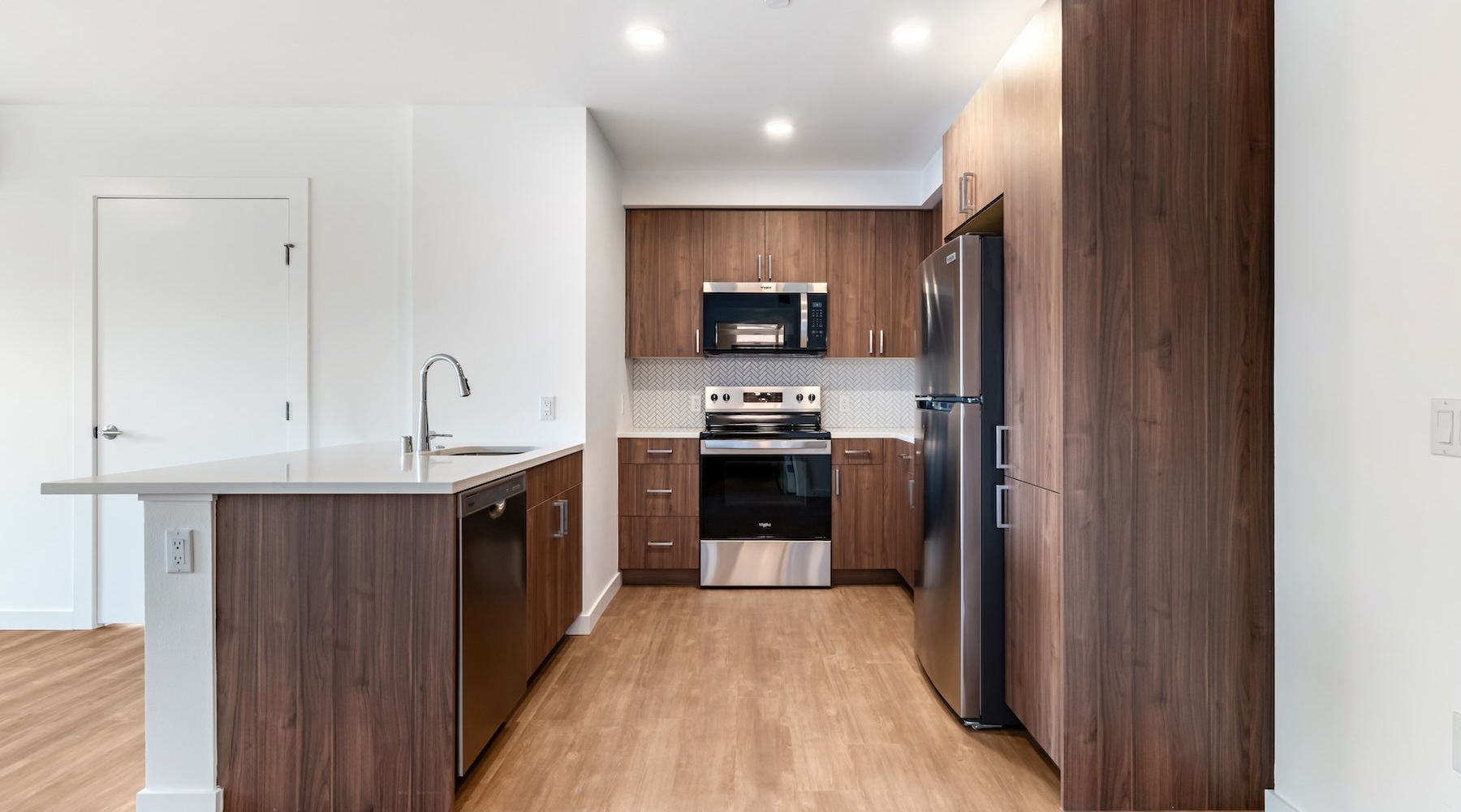 a kitchen with wood cabinets
