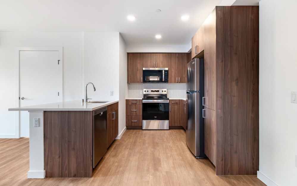 a kitchen with wood cabinets
