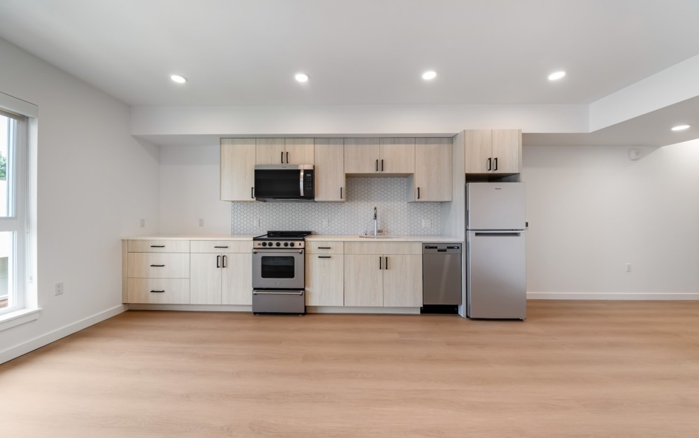 a kitchen with wood cabinets