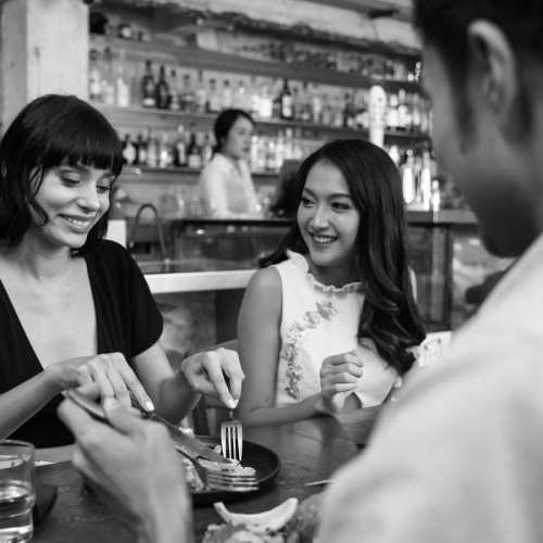 a group of people sitting at a table