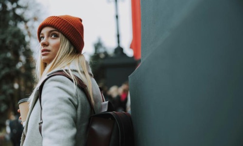 a woman wearing a red beanie