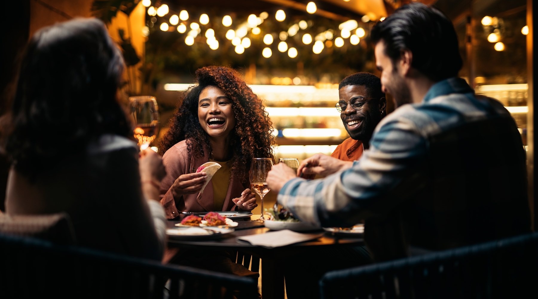 a group of people eating dinner